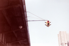 red-and-green-traffic-light-hanging-over-west-street